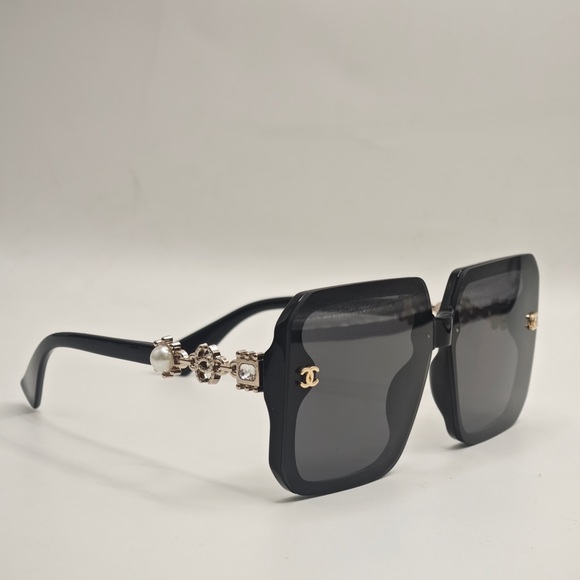 CHANEL Accessories - CHANEL Elegant Black Sunglasses with Gold Accents